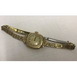 A 9ct gold cased vintage ladies wrist watch. "Everite" Queen swiss made.