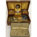 A vintage ballerina jewellery box containing a small quantity of costume jewellery.