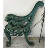 A pair of green painted cast iron scroll design garden bench ends.