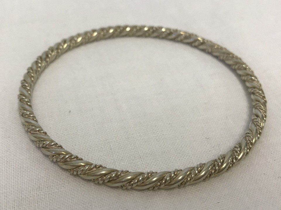 Good quality silver bangle with twisted design.