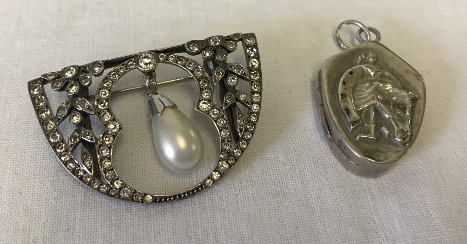 A vintage stone set converted white metal brooch.