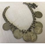 A silver bracelet marked 800 with charms.