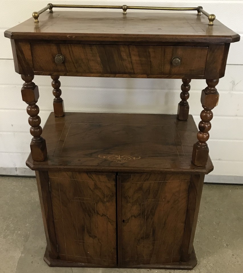 A vintage 2 door hall cabinet with inlaid detail. Upper shelf has central drawer and brass rail back