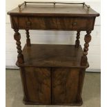 A vintage 2 door hall cabinet with inlaid detail. Upper shelf has central drawer and brass rail back