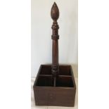 A reproduction dark wood wine bottle stand.