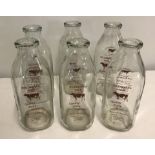 6 square one quart glass American milk bottles.