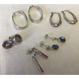 5 pairs of silver earrings.