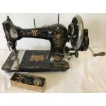 An uncased vintage CWS "Federation Family Machine" sewing machine.