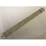 A triple rope design silver bracelet with large clasp fixing.