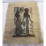 An Egyptian painting on papyrus of red, black, white and gold colouration.