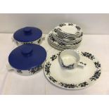 A collection of " Alpine Blue " by Jessie Tait design Midwinter dinnerware.