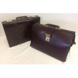2 vintage briefcases. One leather, the other faux leather.