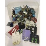 A tub containing approx 80-100 pairs of costume jewellery earrings.