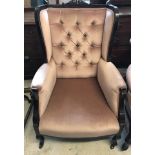 A late Victorian button backed wing chair with dusky pink velvet upholstery.