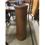 Vintage terracotta tall chimney pot.