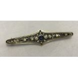 Victorian/Edwardian 9ct gold bar brooch set with clear and blue paste stones.