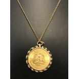 A 1957 Mexican 10 pesos gold coin .900 set in a pendant mount.