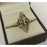 9ct gold dress ring of unusual design, set with 13 diamonds in an ornate setting.