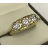 18ct gold & 3 stone diamond gypsy ring.