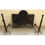 Original Charles II cast iron fire back with a pair of large cast iron fire dogs.