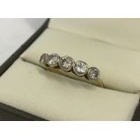 An 18ct gold and diamond half eternity ring.