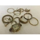 A collection of scrap/broken gold jewellery items.