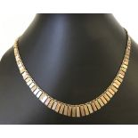 Tri-colour 9ct gold 'Cleopatra' necklace.