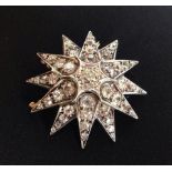 Stunning vintage 12 point gold star brooch / pendant, set with 43 diamonds.