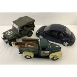 A diecast 1947 Studebaker " Thoms Bait & Tackle " with fishing boat to rear.