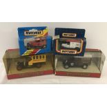 5 boxed Matchbox vans & bus.