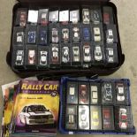 A quantity of 67 cased model Rally cars together with accompanying magazines by DeAgostini.