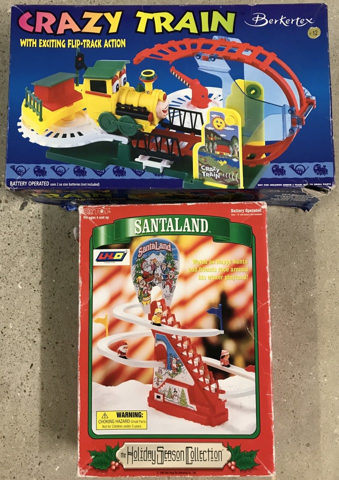 A boxed Berketex Crazy Train playset together with A DY Toy Santa moving toy.