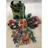 A qty of original 1980's Masters of the Universe He-Man figures, Castle Grey Skull & accessories.