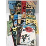 17 Tin Tin paperback comic books.