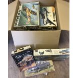 A large quantity of part made plastic model kits.