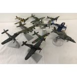 10 Corgi military aircraft models all on stands.