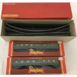 2 boxed Hornby 00 gauge train carriages together with a small quantity of 00 gauge track.