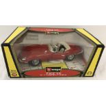 A boxed Burago Jaguar E cabriolet (1961) 1/18 scale.