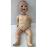 A German bisque head baby doll.