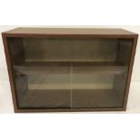 A wood effect wall hanging display cabinet.