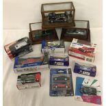 3 glass cased mixed diecast cars, 2 James Bond and a classic mini.