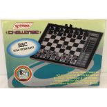 A vintage boxed Systema "Challenge" electronic chess game.