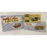 3 modern boxed die cast vehicles comprising;