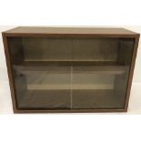 A wood effect wall hanging display cabinet.