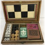An vintage wooden cased games compendium.