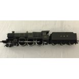 An unboxed Hornby 00 gauge GW " Neath Abbey" 5090 train and tender.