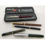 A small collection of vintage ball point and fountain pens.