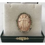 An oval cameo brooch / pendant depicting the 3 graces in a marcasite mount.