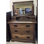An Art Nouveau 3 drawer mirror backed dressing table with 2 small vanity drawers to top.