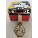 A Disney Parks Minnie Mouse ladies wristwatch with special edition tin.